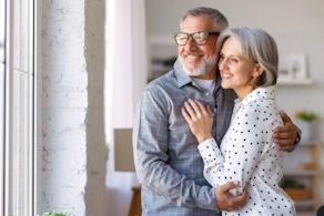 Life Assure Seniors Man And Woman Hugging Looking Out Window Blog